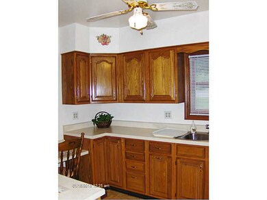 Kitchen. Vinyl floor, light and bright, two window