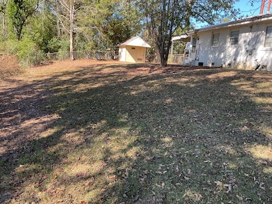 Back yard with 9 x 9 storage building