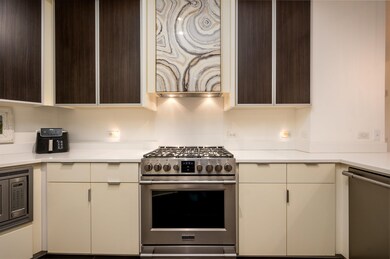 Kitchen with dark brown cabinets, stainless steel 