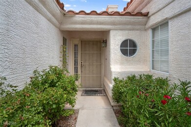 Entrance to property featuring stucco siding
