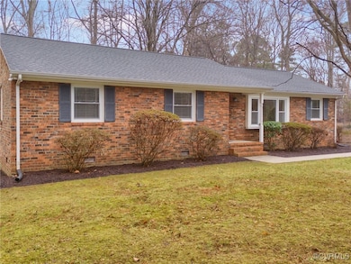 Single story home featuring a front yard