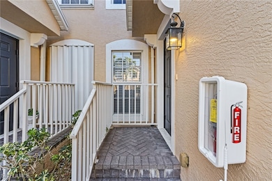 Property entrance with a balcony