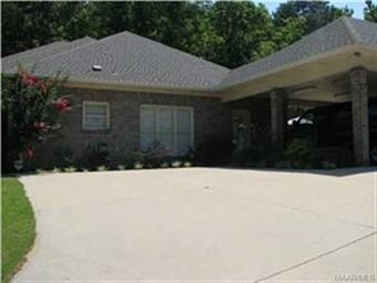 Double carport next to the double parking pad.