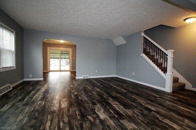Spacious Living Room showing off beautiful wood la