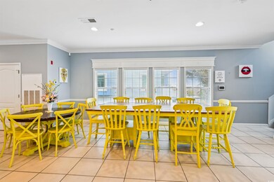 Dining area featuring crown molding, plenty of natural light, light tile patterned flooring, and recessed lighting