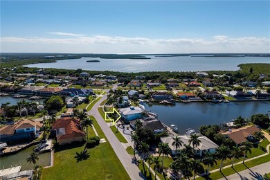 Aerial perspective of suburban area with a nearby body of water