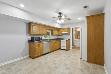 The Full Finished Daylight Basement offers Incredible Flexibility with an Apartment/In-Law Suite featuring its Own Private Entrance, Full Kitchen, Laundry Room, Full Bath, and Separate Garage.