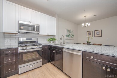 RENOVATED Kitchen with wood cabinetry, tile backsp
