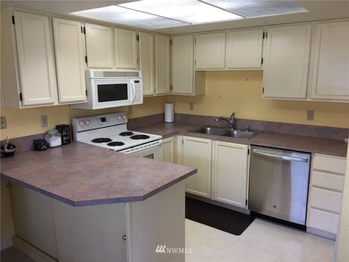 Clean and efficient kitchen with ample storage. Newer stainless steel dishwasher. Convenient breakfast bar for those quick meals.