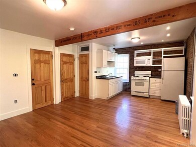 Kitchen, closet, door to bath.