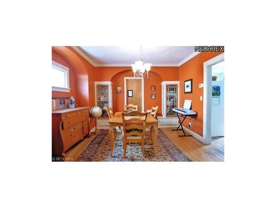 Spacious dining room with built-in cabinets, hardw