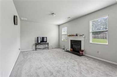 Cozy Gas Log Fireplace with New Carpet