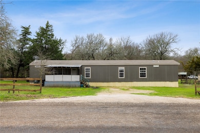 View of front of property with driveway and a fron