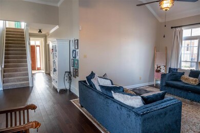Hardwood entry hall leads from front door to great