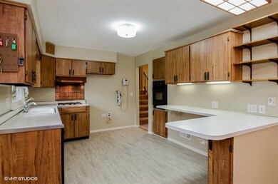 New laminate flooring and exterior access to the driveway.