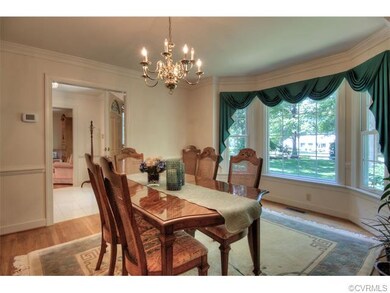 Sophisticated formal dining room with a bay window