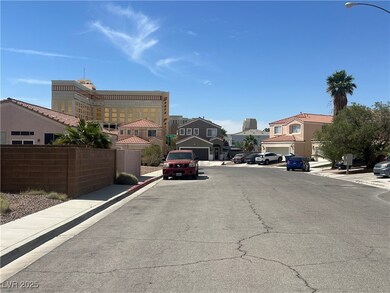 View of asphalt road with street lights, curbs, si