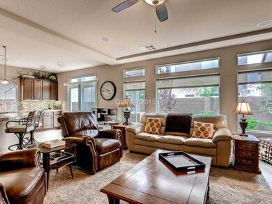 Living Room. Living room features ceiling fan & sl