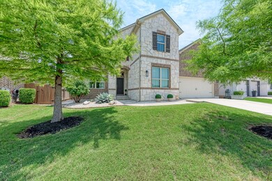 View of front of property featuring stone siding,