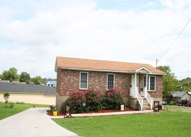 Newer concrete drive and sidewalk. Nicely landscaped.