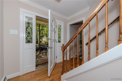 Foyer entrance featuring hardwood / wood-style flo
