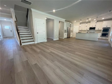 Unfurnished living room with baseboards, ornamenta
