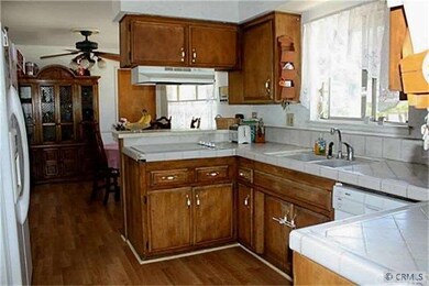 Kitchen and dining room with new laminate floors. 