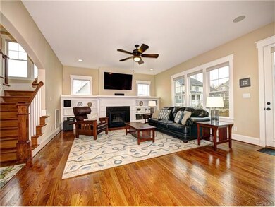 Gorgeous open family room with gleaming hardwood f