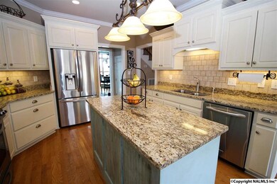 LOOK AT THE SPACE AND THE UPGRADES IN THIS KITCHEN!!  FROM TILE BACKSPLASH TO CUSTOM ISLAND!  GRANITE NEW LIGHT FIXTURES AND MORE!  THE COOK WILL ENJOY THIS GATHERING SPACE!!