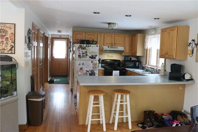 Open concept kitchen, dining room,...