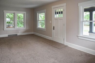 Spacious living room with wide baseboards and new 