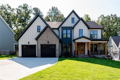 Modern inspired farmhouse featuring a garage, a po