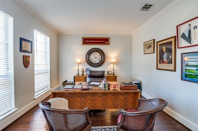 Office space featuring dark wood-type flooring and