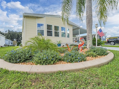 View of front of house featuring an attached carport and covered porch