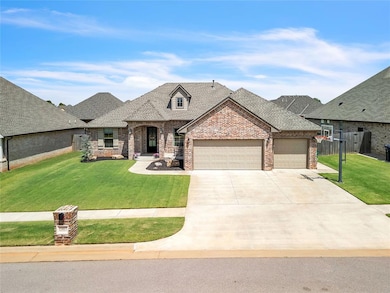 French country home featuring a front yard, brick siding, a shingled roof, and a garage