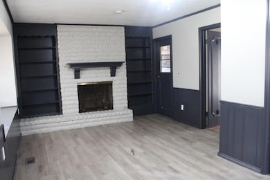Den with fireplace. Access to garage & living room