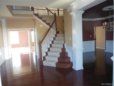 View of Foyer, Wainscoting, and Entrances to Dinin