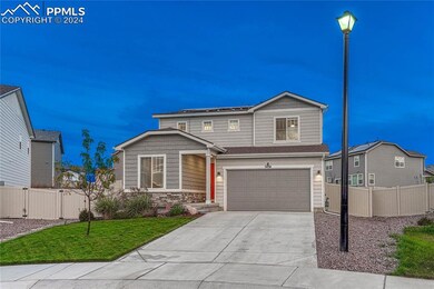 View of front of house with two-car garage and bea