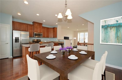 Gleaming hardwood floors, stainless steel applianc