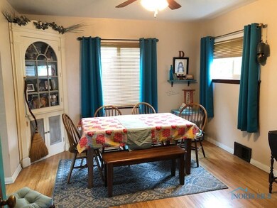Formal Dining Room with hardwood floors, built-ins