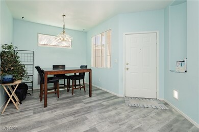 Dining area with wood finished floors and baseboards