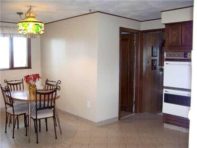 Kitchen. There is a full bath and step down to the