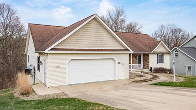 View of front of home featuring a garage