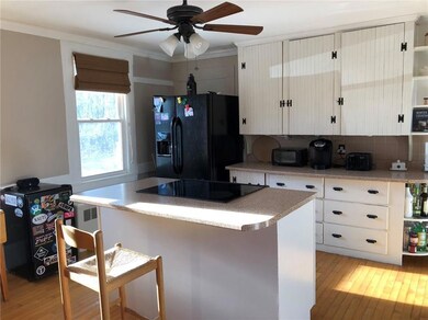 Bright, sunny kitchen with wood...