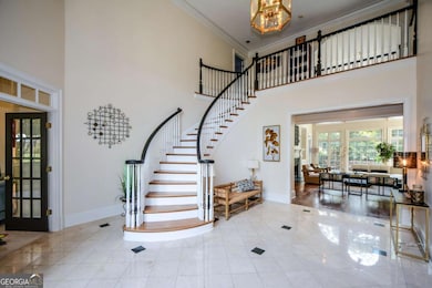 Stunning two-story foyer with lots of natural light.