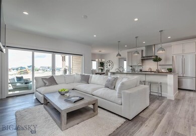 Open concept kitchen/living area with covered pati
