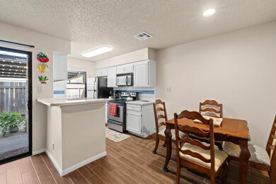 Kitchen featuring visible vents, wood tiled floor