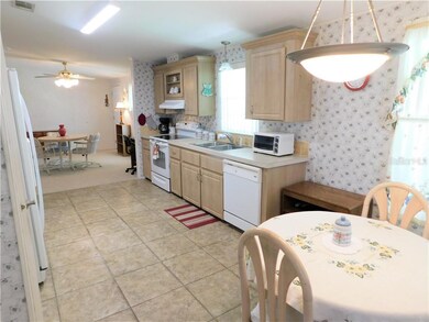 Open kitchen with tile flooring.