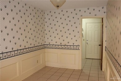 Unfurnished room featuring light tile patterned floors