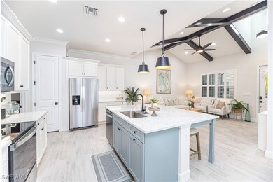 Kitchen featuring sink, pendant lighting, stainles